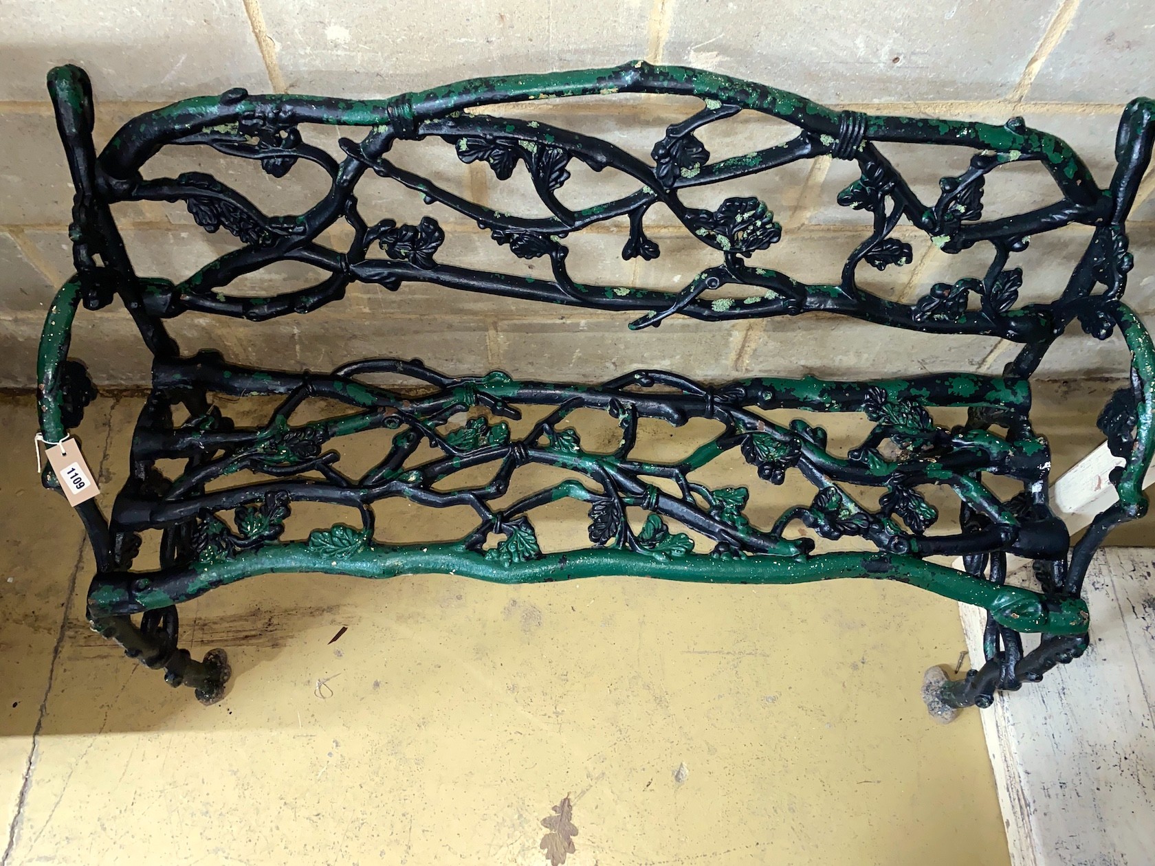 A Victorian Coalbrookdale style cast iron garden bench, length 124cm, depth 57cm, height 77cm